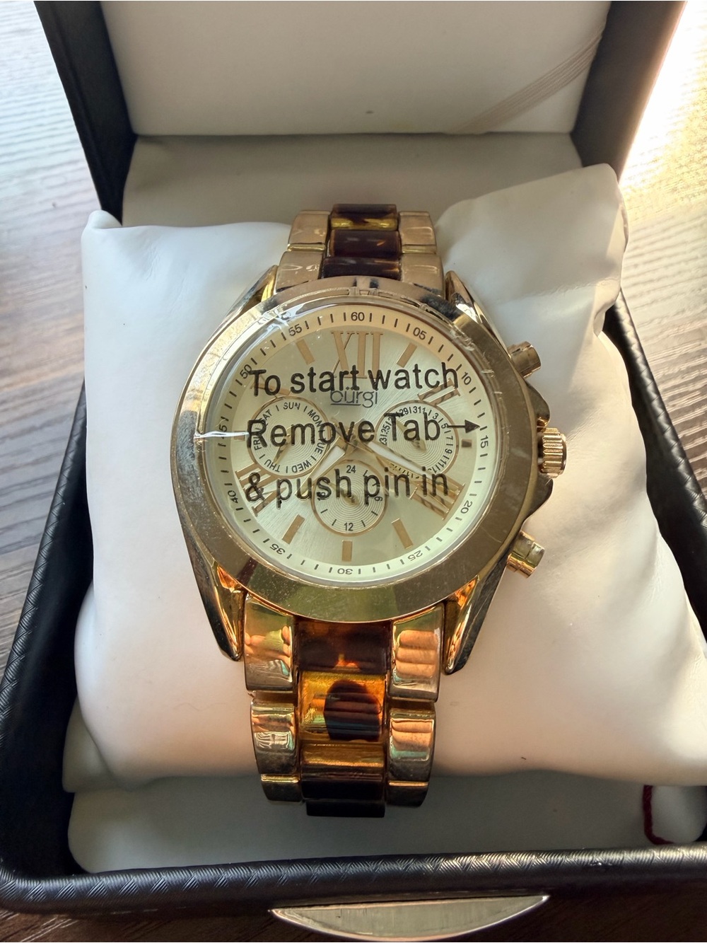 Burgi Gold Women's Watch with tortoise design on the band